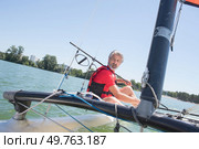 enjoying extreme sailing with racing sailboat. Стоковое фото, агентство Ingram Publishing / Фотобанк Лори