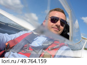 confident male pilot in glider cockpit. Стоковое фото, агентство Ingram Publishing / Фотобанк Лори