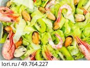 Homemade seafood salad with mussels and shrimps. Food background. Colorful mussel and shrimp salad, close up. Стоковое фото, агентство Ingram Publishing / Фотобанк Лори