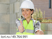 a cheerful female architect with thumbs up. Стоковое фото, агентство Ingram Publishing / Фотобанк Лори