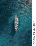 A boat sailing in the vast expanse of the ocean, viewed from above.. Boat Sailing on Ocean. Стоковое фото, агентство Ingram Publishing / Фотобанк Лори