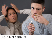 frustrated mother and son smoking. Стоковое фото, агентство Ingram Publishing / Фотобанк Лори
