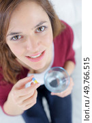 close-up of a woman taking medication. Стоковое фото, агентство Ingram Publishing / Фотобанк Лори