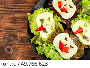 Simple healthy sandwiches recipe from toast bread on rustic wooden table. Space for text.. Funny Monster Face Sandwiches. Стоковое фото, агентство Ingram Publishing / Фотобанк Лори