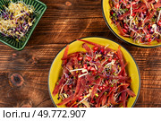 Tasty salad made from a mixture of sprouted alfalfa, beans, red radish with pomegranate on rustic wooden table.. Diet vegan sprouts salad. Стоковое фото, агентство Ingram Publishing / Фотобанк Лори