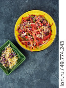 Salad made from a mixture of sprouted alfalfa, beans, red radish with pomegranate seeds. Top view.. Sprouts and pomegranate salad. Стоковое фото, агентство Ingram Publishing / Фотобанк Лори