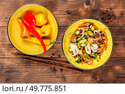 Delicious salad of squid tentacles or calamari and vegetables in a bowl. Rustic style.. Exotic salad of squid tentacles. Стоковое фото, агентство Ingram Publishing / Фотобанк Лори