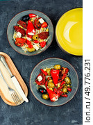 Pickled soya bean salad with pickled soybean sprouts, dried tomatoes, olives and peppers. Korean Food.. Salad of preserved soy sprouts and pickled vegetables. Стоковое фото, агентство Ingram Publishing / Фотобанк Лори