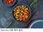 Mussels in cream sauce with tomatoes and garlic. Healthy food concept. Top view.. Plate of mussels on a table. Стоковое фото, агентство Ingram Publishing / Фотобанк Лори