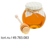 glass pot with floral honey and stick isolated on white background. honey in glass pot and stick. Стоковое фото, агентство Ingram Publishing / Фотобанк Лори