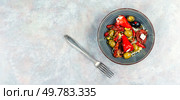 Pickled soya bean salad with pickled soybean sprouts, dried tomatoes, olives and peppers. Free space for your text.. Salad of preserved soy sprouts and pickled vegetables. Стоковое фото, агентство Ingram Publishing / Фотобанк Лори