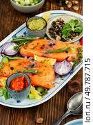 Raw salmon fillet, fish prepared for marinating. Spices, sauces and herbs. Raw salmon fish and spices. Стоковое фото, агентство Ingram Publishing / Фотобанк Лори