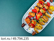 Appetizing kebab or shashlik of meat and potatoes. Meat fried on skewers with potatoes. Space for text.. Meat kebab with potatoes. Стоковое фото, агентство Ingram Publishing / Фотобанк Лори