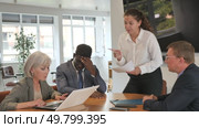 Angry young woman shouting at her business partners sitting around table in conference room. Стоковое видео, видеограф Яков Филимонов / Фотобанк Лори