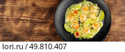 Sea scallop appetizer cooked in butter. Free space for your text.. Seared scallops on a plate. Стоковое фото, агентство Ingram Publishing / Фотобанк Лори