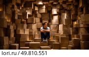 A person trapped in a house made of cardboard boxes. Symbol of a major environmental problem caused by urban overconsumption waste. Abstract image. Стоковое AI-изображение, AI-художник ALLA YURTAYEVA / Фотобанк Лори