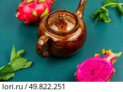 Delightfully brewed dragon fruit tea served with raw pitaya.. Vibrant arrangement of dragon fruit tea. Стоковое фото, агентство Ingram Publishing / Фотобанк Лори