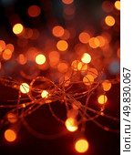 Strings of warm orange lights twinkle gently, casting a soft glow in a vibrant setting. The enchanting ambiance invites warmth and togetherness among friends at a cozy evening Generative AI. Стоковое AI-изображение, AI-художник Юлия Петровская / Фотобанк Лори