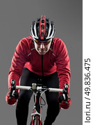 Cyclist on road bike on grey background. Стоковое фото, агентство Ingram Publishing / Фотобанк Лори
