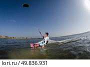 Kiteboarder enjoy surfing on a sunny day. Стоковое фото, агентство Ingram Publishing / Фотобанк Лори