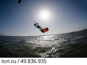 Kiteboarder enjoy surfing on a sunny day. Стоковое фото, агентство Ingram Publishing / Фотобанк Лори
