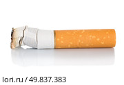 Cigarette butt isolated on a white background. Стоковое фото, агентство Ingram Publishing / Фотобанк Лори