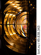 Vertical view showcasing a lighthouse Fresnel lens of Lighthouse lamp. Стоковое фото, фотограф EugeneSergeev / Фотобанк Лори