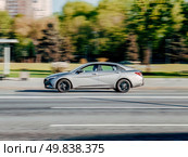 Hyundai Elantra 2020 CN7 at the city road in motion. Gray car driving along the street in city. Accelerating with low-emission. Редакционное фото, фотограф Константин Григорьев / Фотобанк Лори