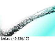 Air bubbles in blue water on white background. Стоковое фото, агентство Ingram Publishing / Фотобанк Лори