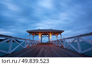 jetty walkway with pavillion at dusk, Srichang Island Pattaya Thailand. Стоковое фото, агентство Ingram Publishing / Фотобанк Лори