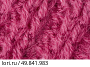 Pink knitted wool texture can use as background. Стоковое фото, агентство Ingram Publishing / Фотобанк Лори