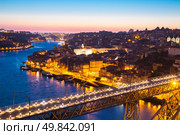 Porto Cityscape Portugal at dusk with Dom Luiz bridge. Стоковое фото, агентство Ingram Publishing / Фотобанк Лори