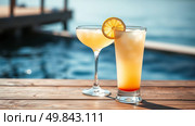 Cocktails on the beach by the sea. Cocktails with orange juice and ice. Стоковое AI-изображение, AI-художник Васильева Юлия / Фотобанк Лори