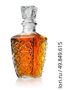 Crystal decanter with cognac isolated on white. Стоковое фото, агентство Ingram Publishing / Фотобанк Лори
