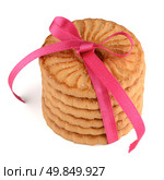 Festive wrapped rings biscuits pile isolated on a white background. Стоковое фото, агентство Ingram Publishing / Фотобанк Лори