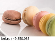 Classic Macarons with Raspberry, Coffee, Chocolate and Pistachios Filled with Cream, French Pastry. Стоковое фото, агентство Ingram Publishing / Фотобанк Лори