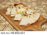 freshly cooked pizza calzone. pieces. Стоковое фото, агентство Ingram Publishing / Фотобанк Лори