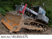 Dirty tractor in the ground. Стоковое фото, агентство Ingram Publishing / Фотобанк Лори