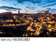 Toledo Cityscape with Alcazar at dusk in Madrid Spain. Стоковое фото, агентство Ingram Publishing / Фотобанк Лори