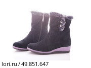 Beautiful, black boots with zips and buckles made of suede. On a white background. Стоковое фото, агентство Ingram Publishing / Фотобанк Лори
