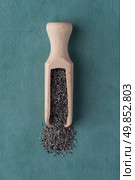 Top view of poppy seeds against blue vinyl background. Стоковое фото, агентство Ingram Publishing / Фотобанк Лори
