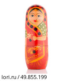 Single russian doll on white reflective background. Стоковое фото, агентство Ingram Publishing / Фотобанк Лори