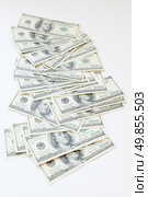 lot of 100 dollar bills on a white background. Стоковое фото, агентство Ingram Publishing / Фотобанк Лори