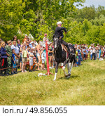 Russia, Samara, June 2016: A dashing Cossack on horseback during a demonstration performance at the Journey to the Past festival. Редакционное фото, фотограф Акиньшин Владимир / Фотобанк Лори
