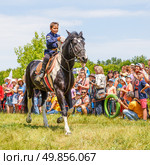 Russia, Samara, June 2016: A dashing Cossack on horseback during a demonstration performance at the Journey to the Past festival. Редакционное фото, фотограф Акиньшин Владимир / Фотобанк Лори