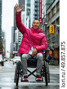 A man wearing a pink jacket is sitting in a wheelchair. Стоковое AI-изображение, AI-художник Данила Большаков / Фотобанк Лори