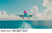 Commercial concept: modern pink and turquoise aircraft over sea, arriving at airport. Стоковое AI-изображение, AI-художник Данила Большаков / Фотобанк Лори