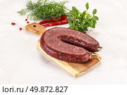 Delicious dry cured beef basturma on table, closeup. Стоковое фото, фотограф Андрей Старостин / Фотобанк Лори