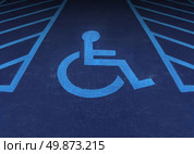 Handicapped and disabled symbol as a parking space with a wheelchair painted on asphalt as a health care and medical icon of reserved space for accessibility of the physically challenged. Стоковое фото, агентство Ingram Publishing / Фотобанк Лори