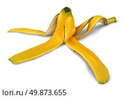 Banana peel on a white background with a shadow as a symbol of danger and risk of slipping on the yellow tropical fruit and an icon of natural garbage discarded for composting and recycling. Стоковое фото, агентство Ingram Publishing / Фотобанк Лори